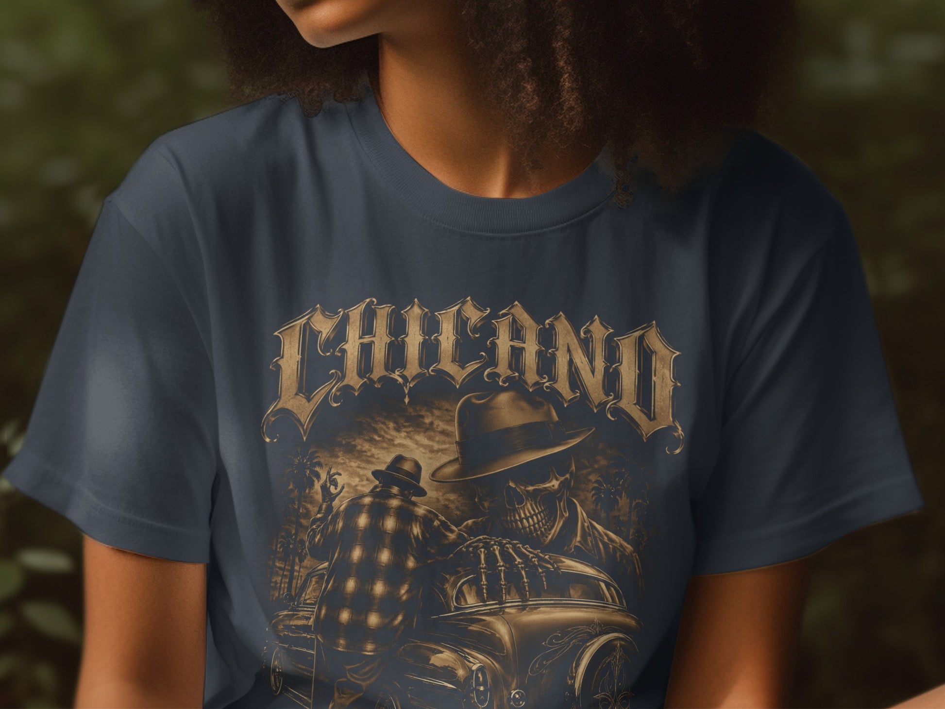 T-shirt with "Chicano" text and skeletal figures by a car.