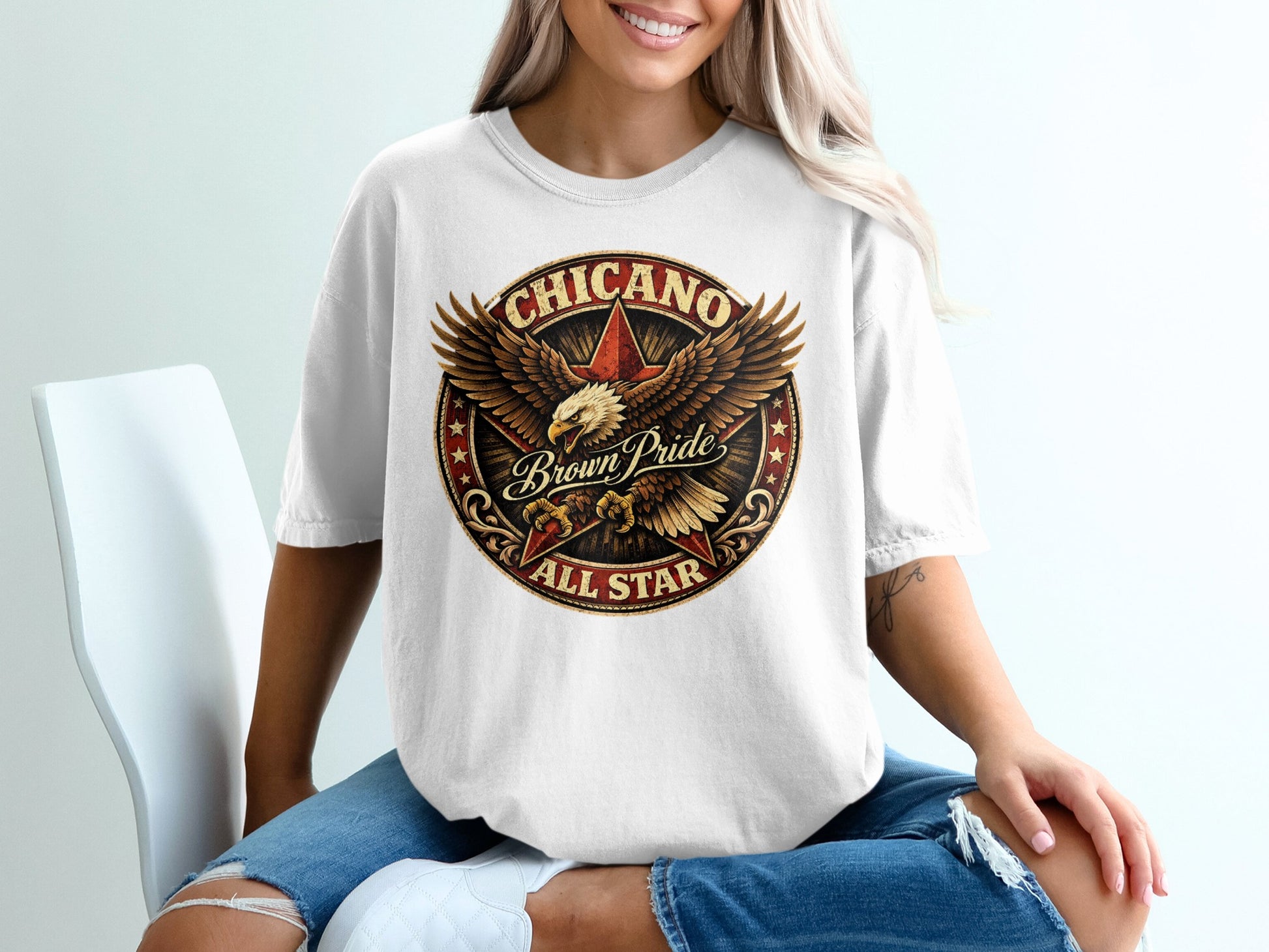 White t-shirt with a circular "Chicano Brown Pride All Star" graphic featuring an eagle.