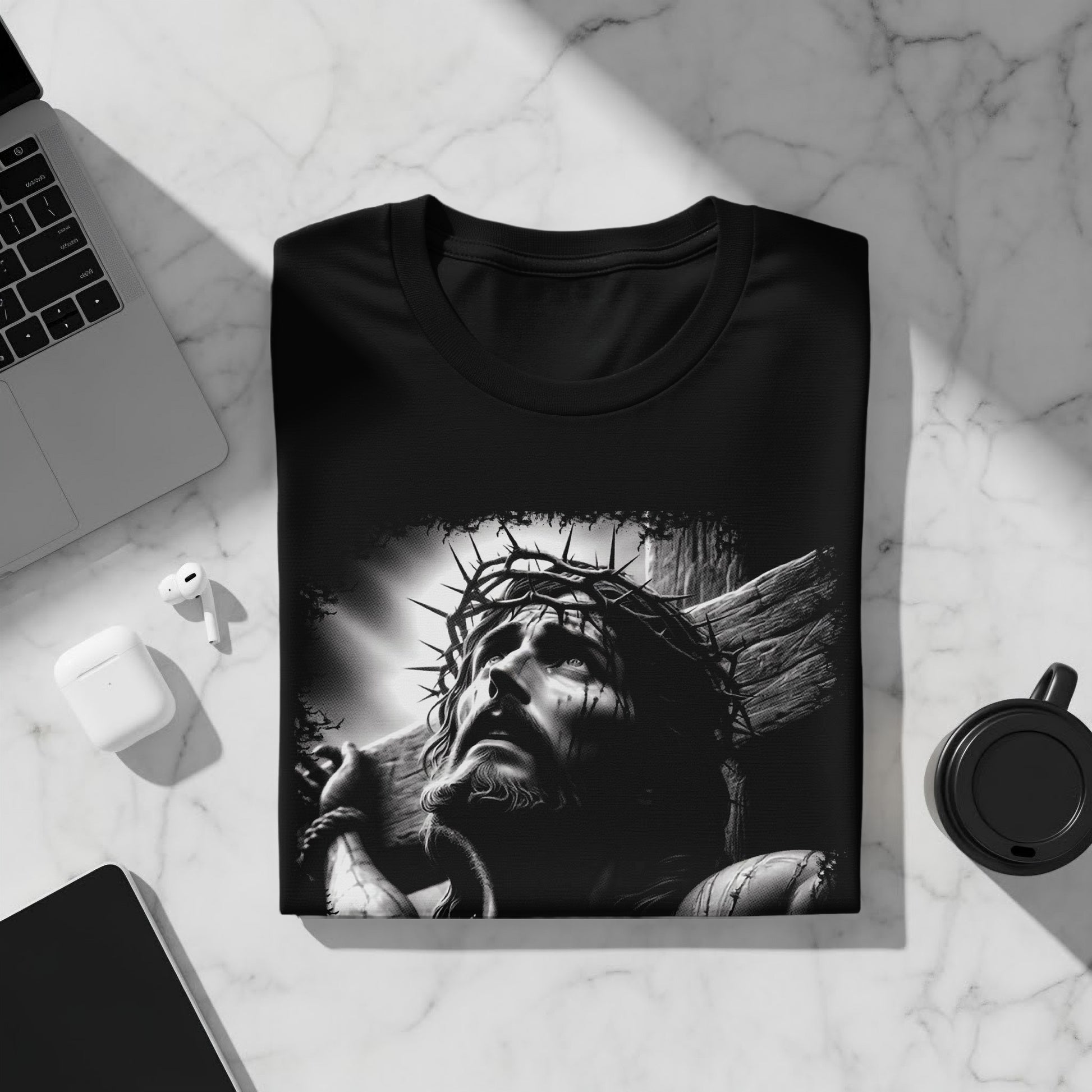 Black t-shirt with a graphic of Jesus Christ on the cross.