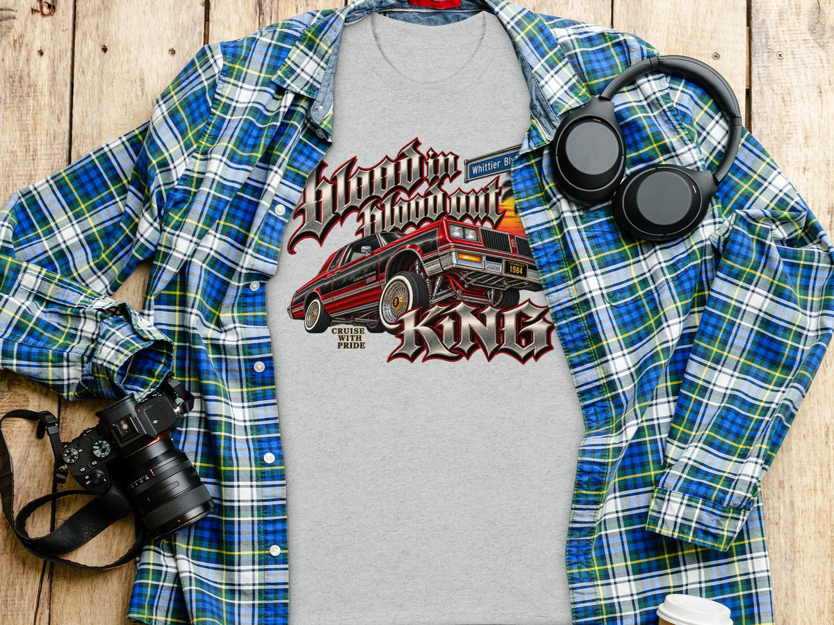 Gray t-shirt with 1984 red car graphic and "KING" text.