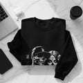 Black sweatshirt with LA Dodgers logo and skull graphic on front.