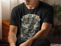 Black t-shirt with La Vida Loca snake and cross graphic.