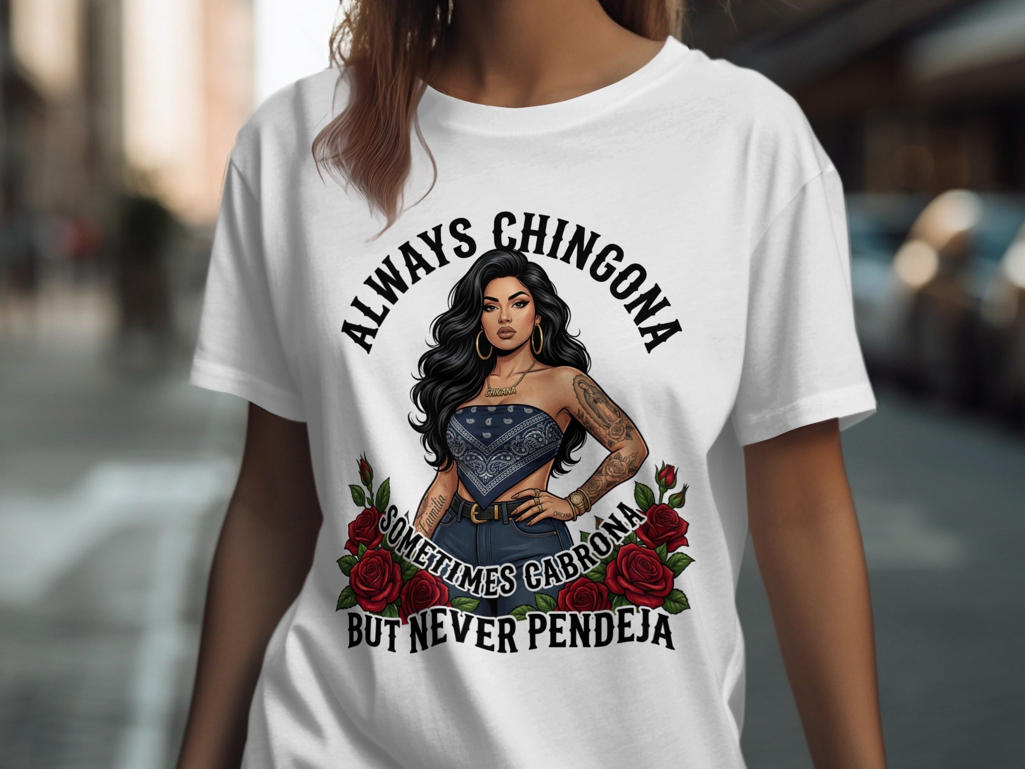 T-shirt with graphic of woman, roses, and text "ALWAYS CHINGONA SOMETIMES CABRONA BUT NEVER PENDEJA".