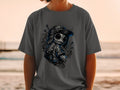 Dark gray t-shirt featuring a stylized, stitched doll with stitches and buttons for eyes.