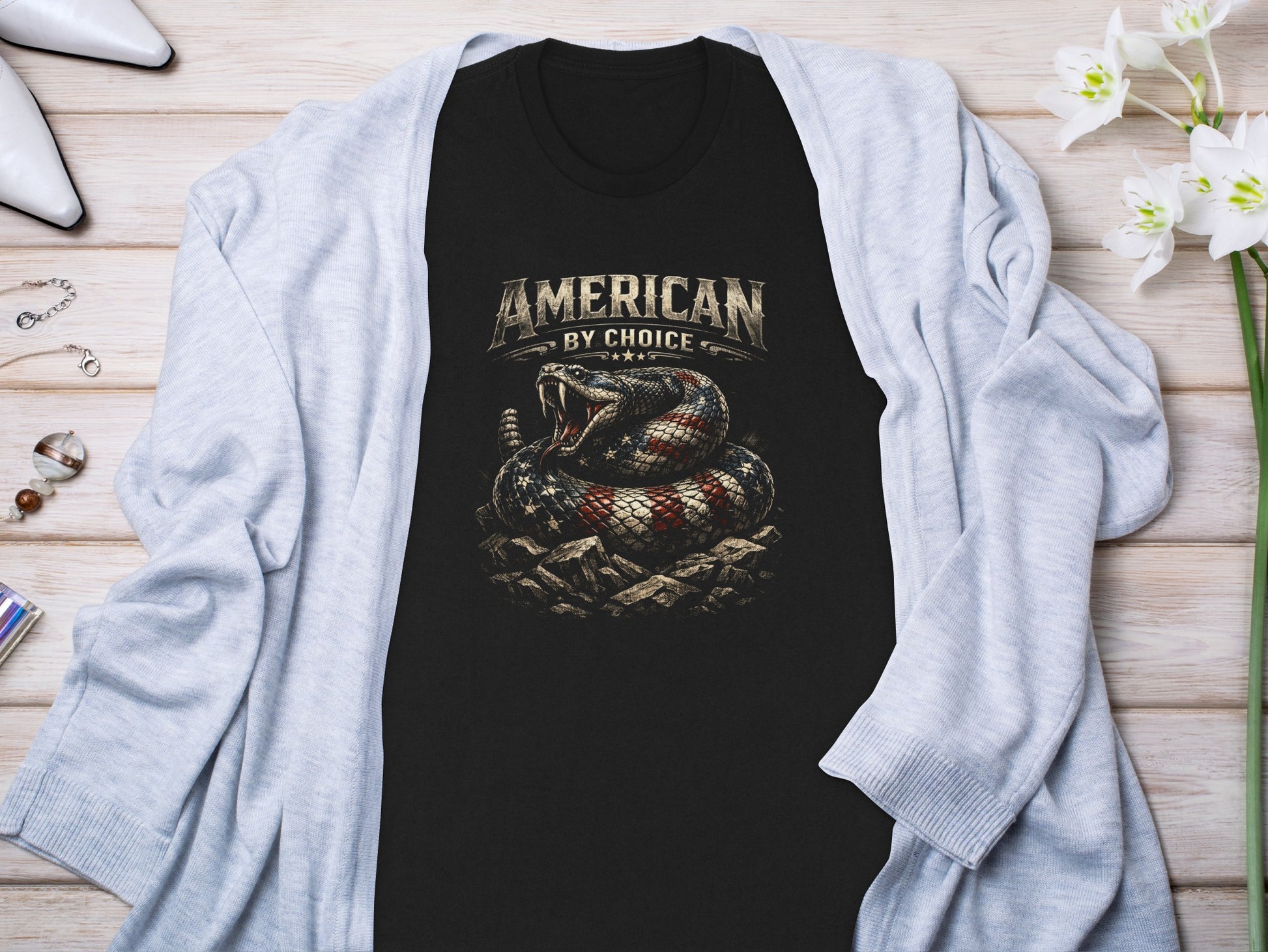 Black t-shirt with "AMERICAN BY CHOICE" and coiled rattlesnake graphic.