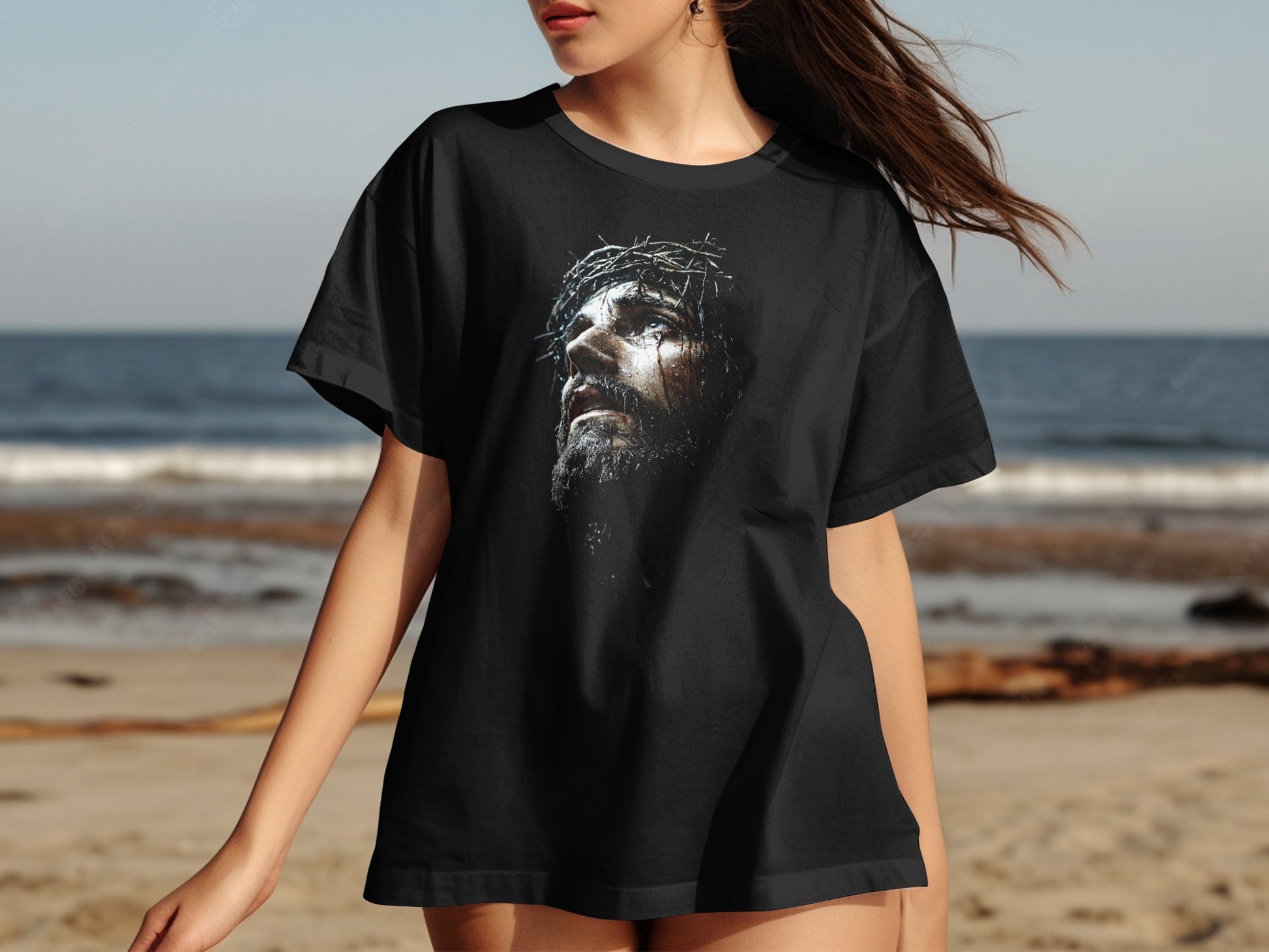 Black t-shirt with a detailed painting of Jesus Christ wearing a crown of thorns.
