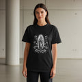 Black t-shirt with Virgin Mary and rose wreath graphic.