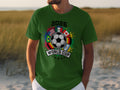 Green t-shirt with 2026 World Cup logo featuring flags, soccer ball, and stars.