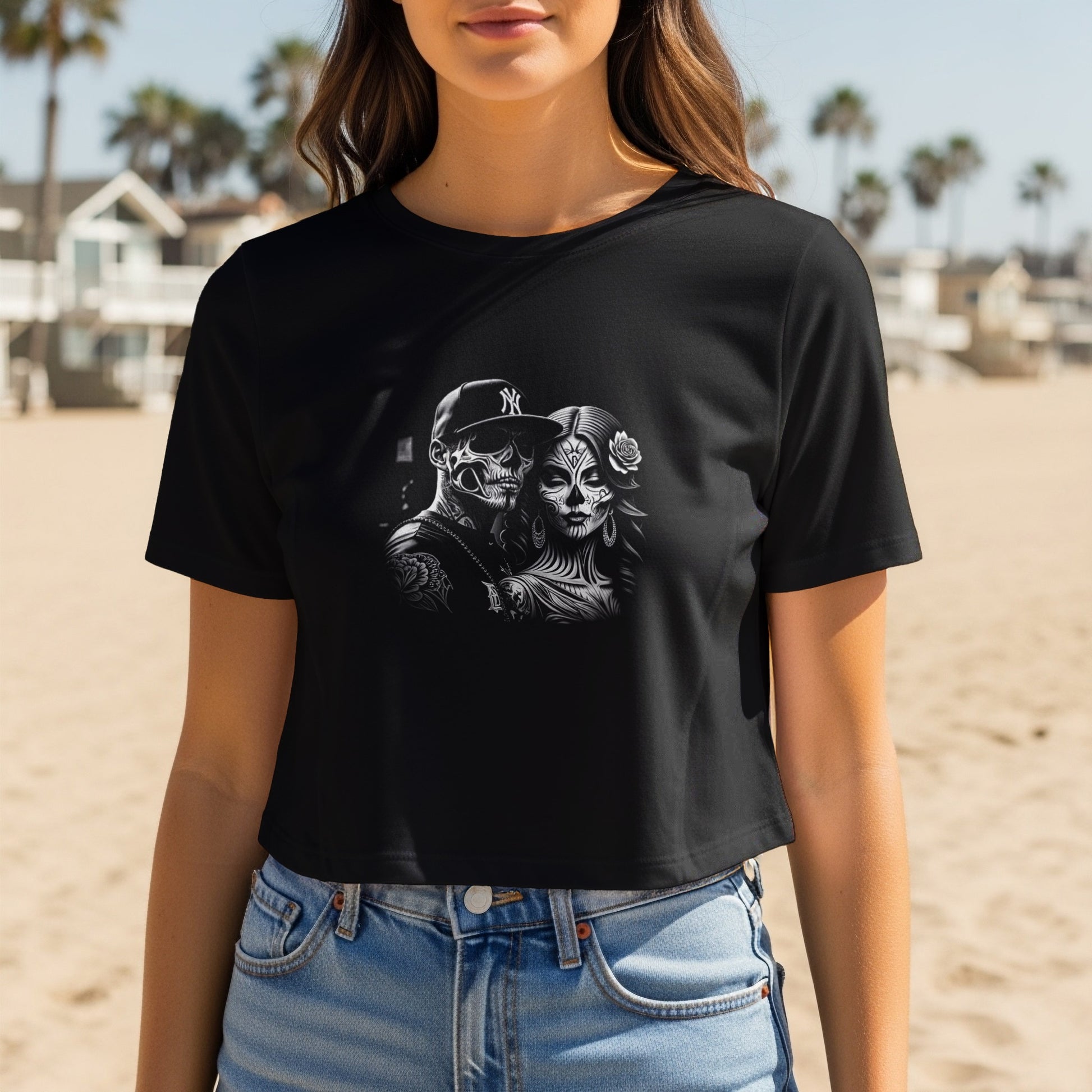 Black t-shirt featuring Day of the Dead inspired skull couple graphic.