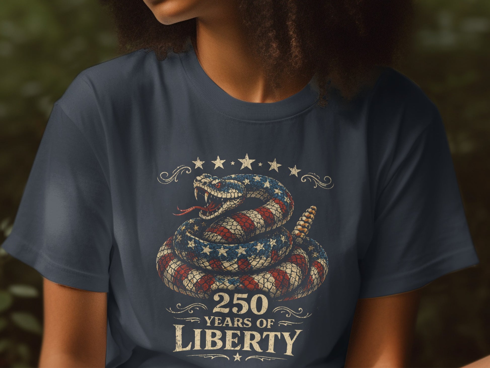 Navy t-shirt with coiled snake graphic, stars, and text "250 Years of Liberty".