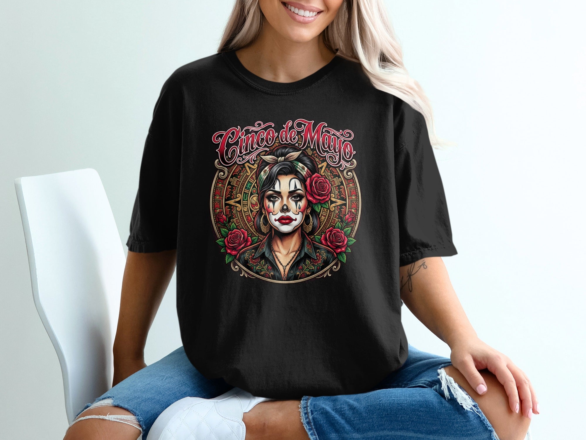 Black t-shirt with Cinco de Mayo sugar skull woman and rose graphic.