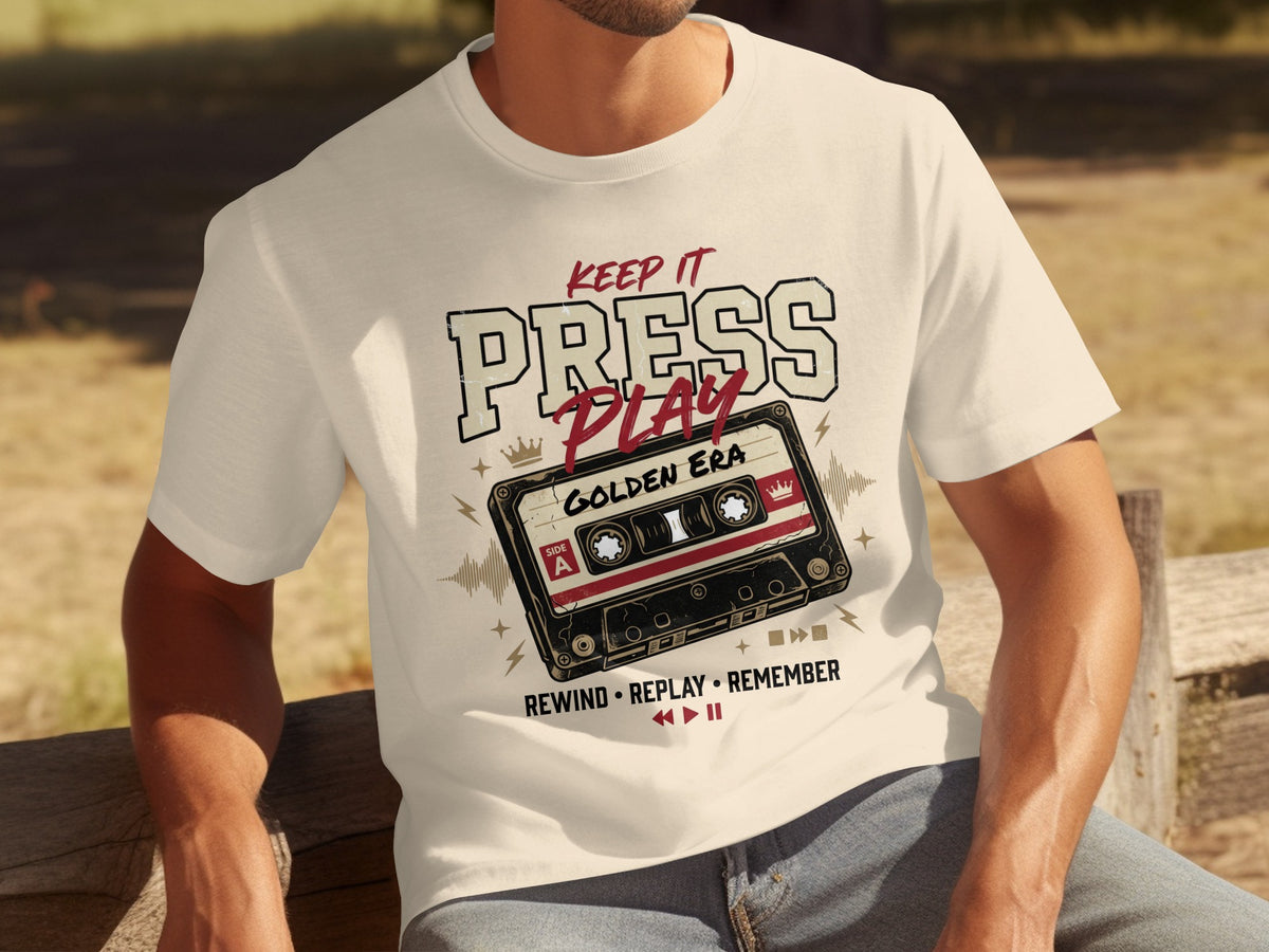 T-shirt with "Keep it Press Play Golden Era" text and a vintage cassette tape.