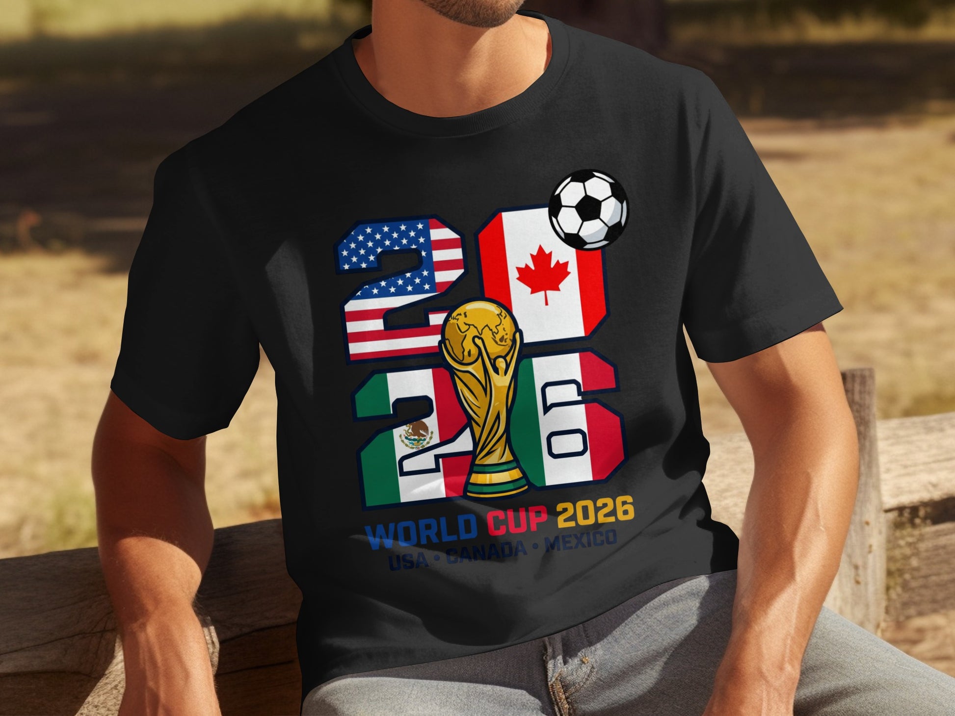 Black t-shirt with "2026 World Cup USA Canada Mexico" graphic featuring flags and trophy.