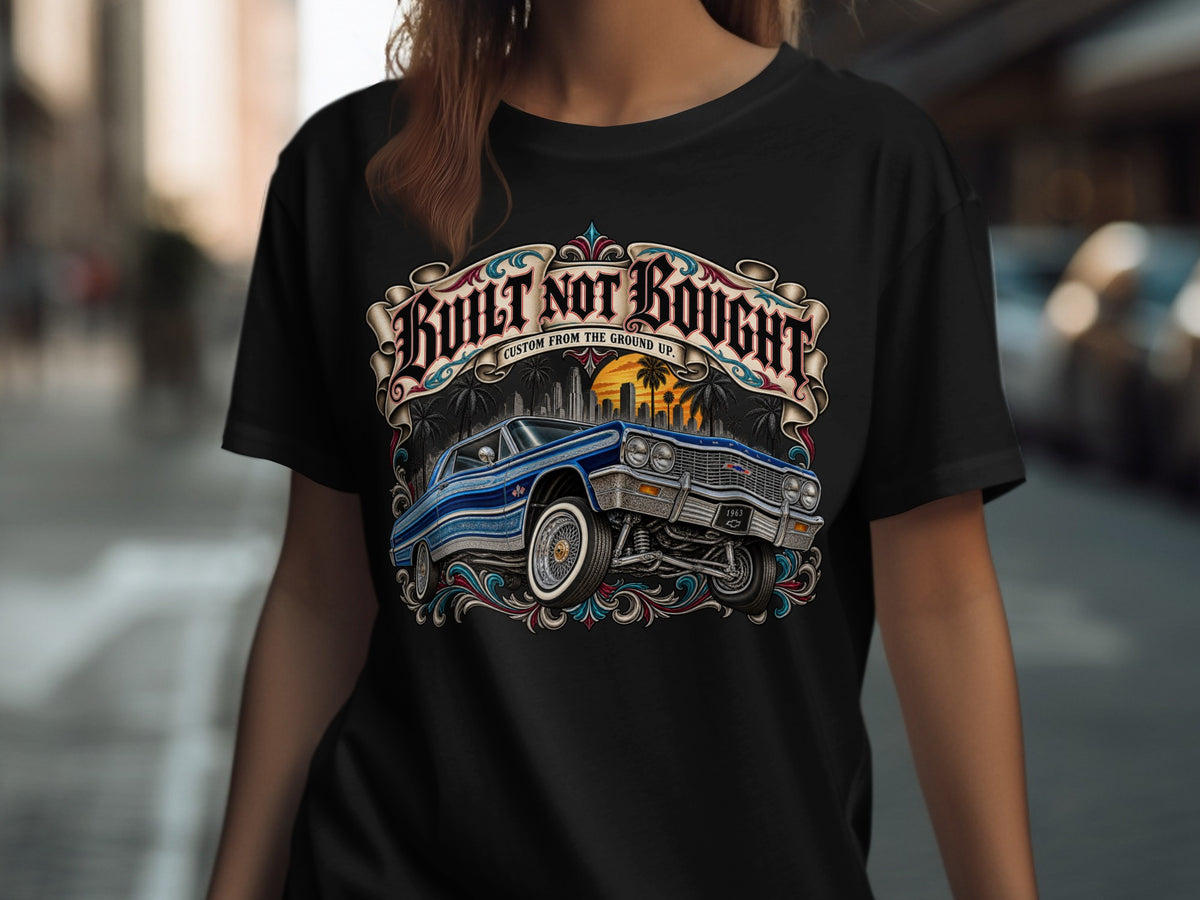 Black t-shirt with "BUILT NOT BOUGHT" text and a blue 1963 Impala.