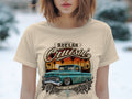 Aztlán Cruisin' graphic on a beige t-shirt featuring a teal lowrider truck.