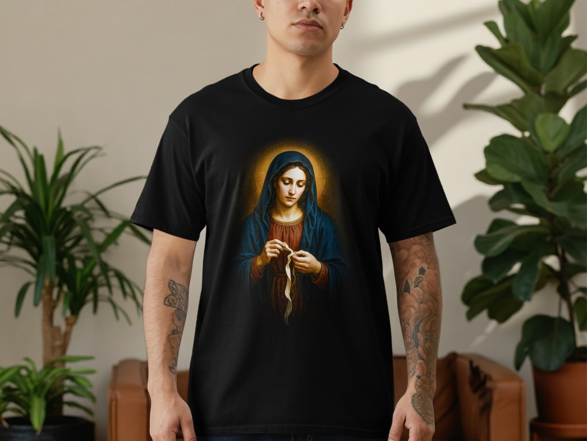T-shirt with religious depiction of Virgin Mary holding prayer beads.