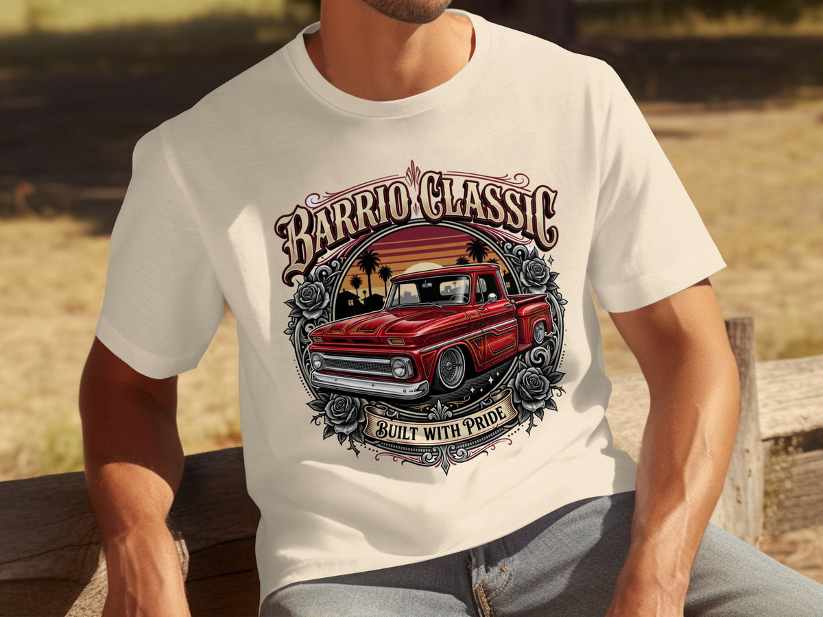 Cream t-shirt with graphic of red truck, roses, palm trees, and "Barrio Classic Built With Pride".